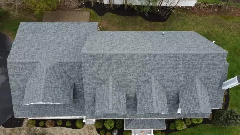 Aerial view of a gray shingle roof on a house.