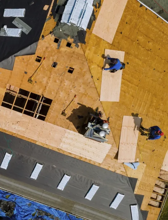 A local roofer inspecting a roof — demonstrating hands-on experience and knowledge of regional conditions.