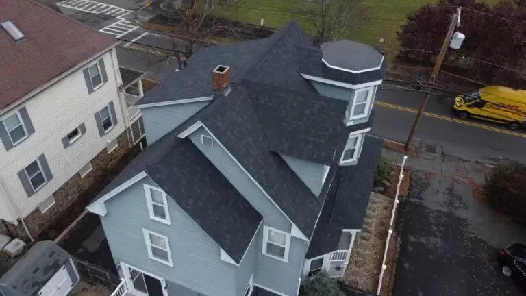 Professional roofer discussing inspection results with a homeowner